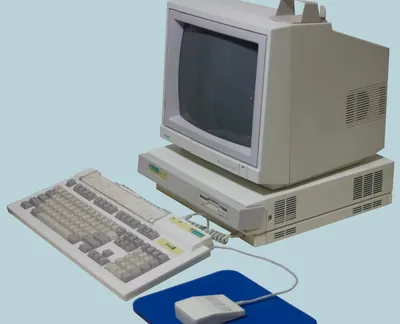 An Acorn Archimedes computer with monitor, keyboard and mouse.