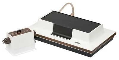 The original Magnavox Odyssey console with controllers and accessories.