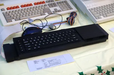 A Sinclair QL home computer on display.