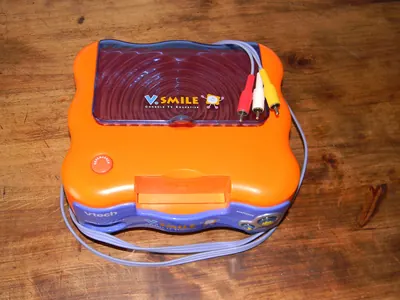 A VTech V.Smile educational console and controller.